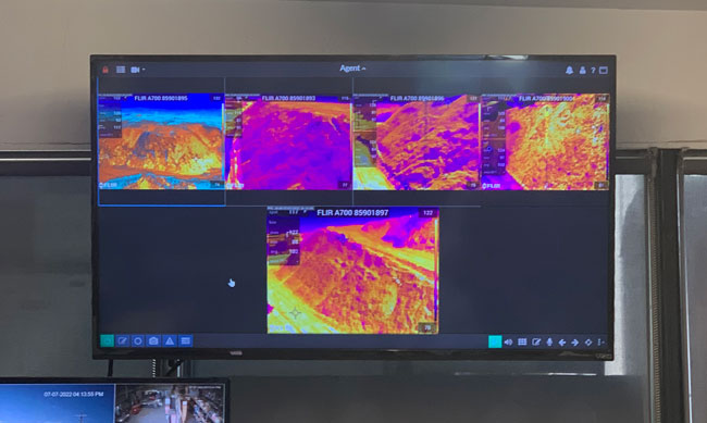 Video-based fire detection system showing different thermal images of different areas in a facility.